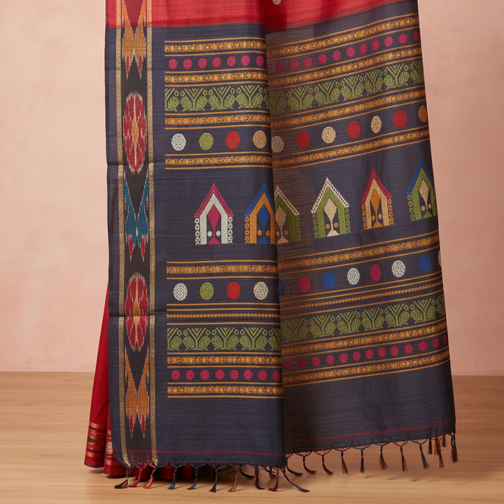 Close-up of the navy blue Tussar silk saree pallu showing multicolour geometric bands, decorative panels and tassels