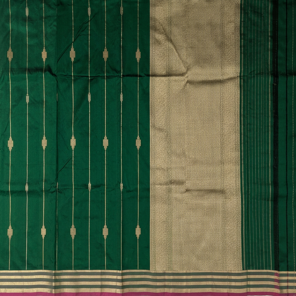 Close-up of gold-toned geometric pallu and fine-striped green end