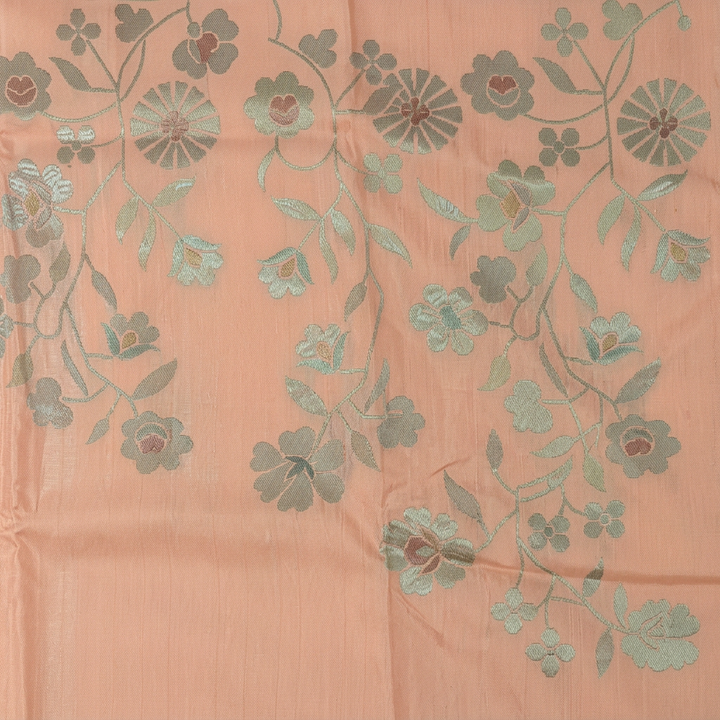 Close-up of grey-sage and mint floral vines on soft pink chiffon