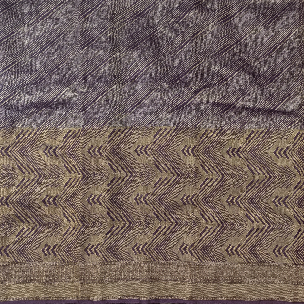 Close-up of purple diagonal pattern and gold-toned chevron section