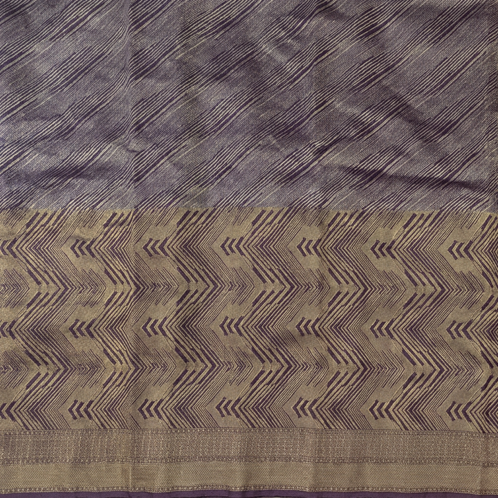 Close-up of purple diagonal pattern and gold-toned chevron section