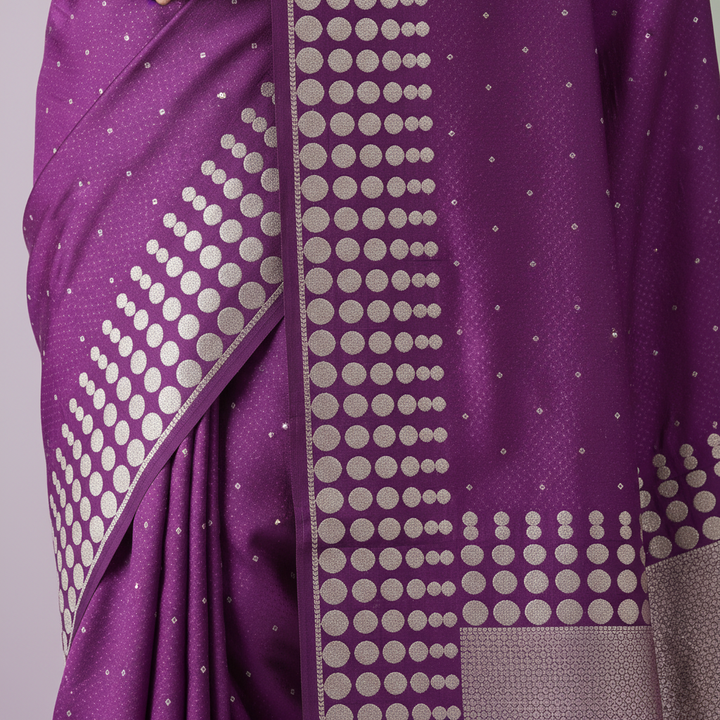 Close-up of the purple Banarasi silk saree silver geometric zari border and pallu
