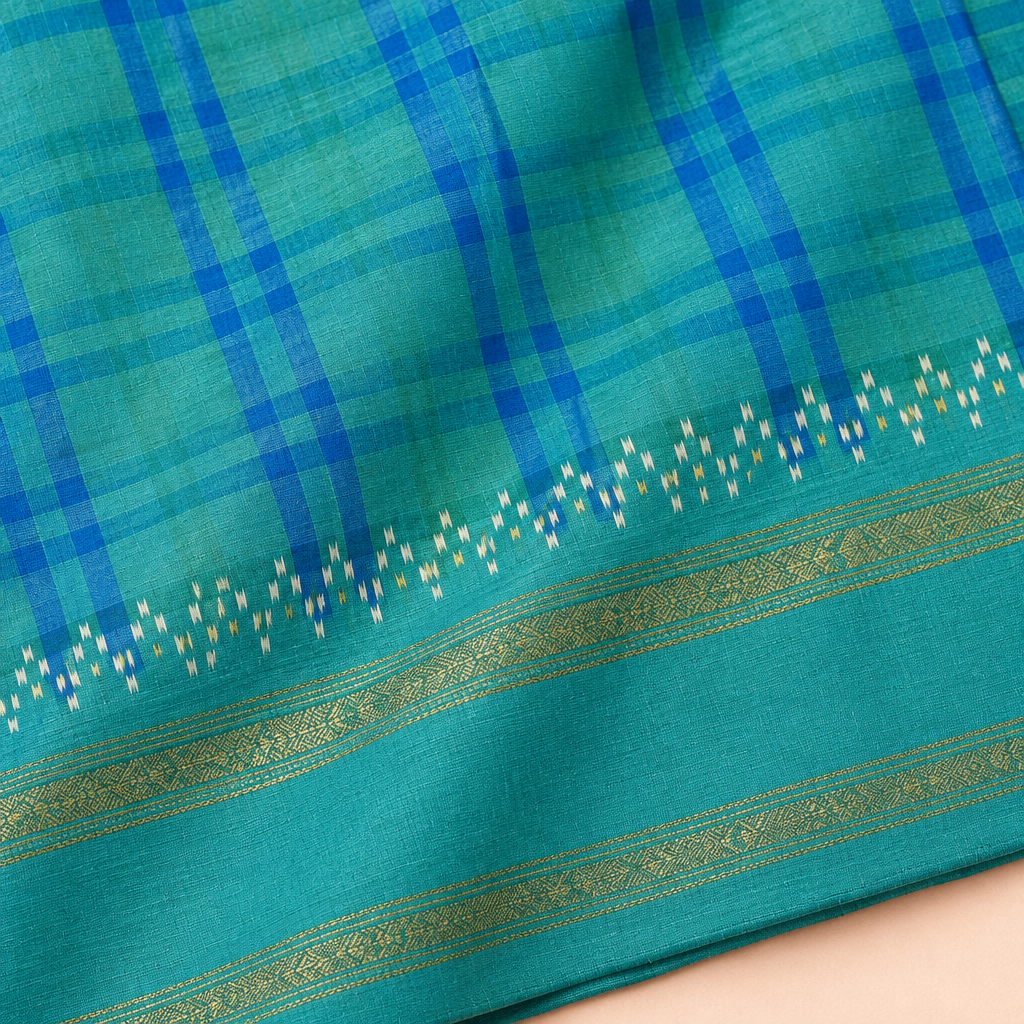Close-up of blue Pochampally silk saree texture, contrast pallu and zari border