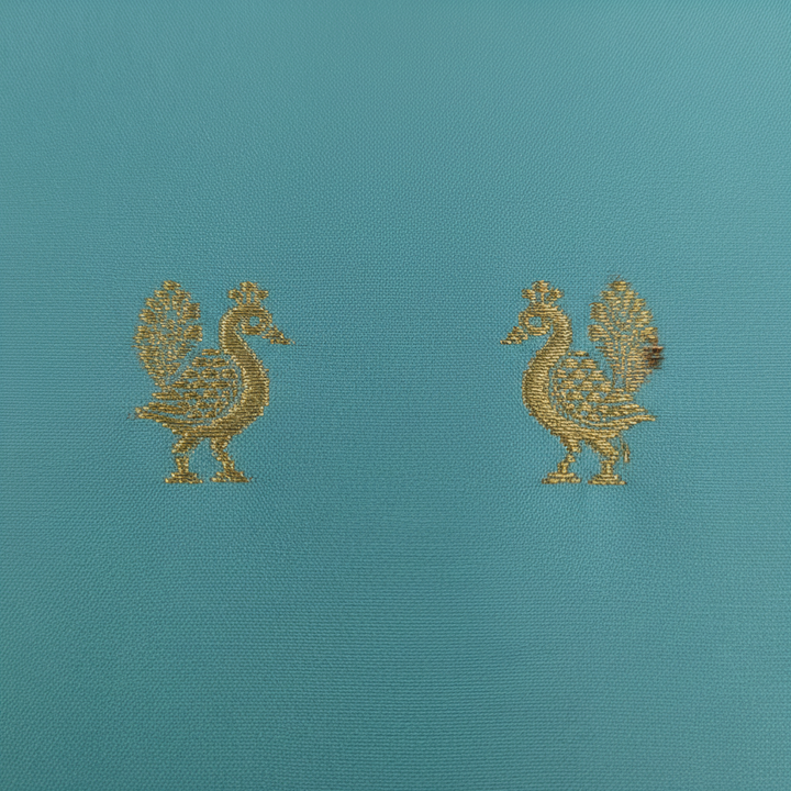 Kuberan  Sky Blue with Scattered Paired Gold Zari Duck (Hamsa) Buttas & Broad Antique Gold Zari Dense Floral Scroll Temple Arch Border Kanchipuram Silk Saree