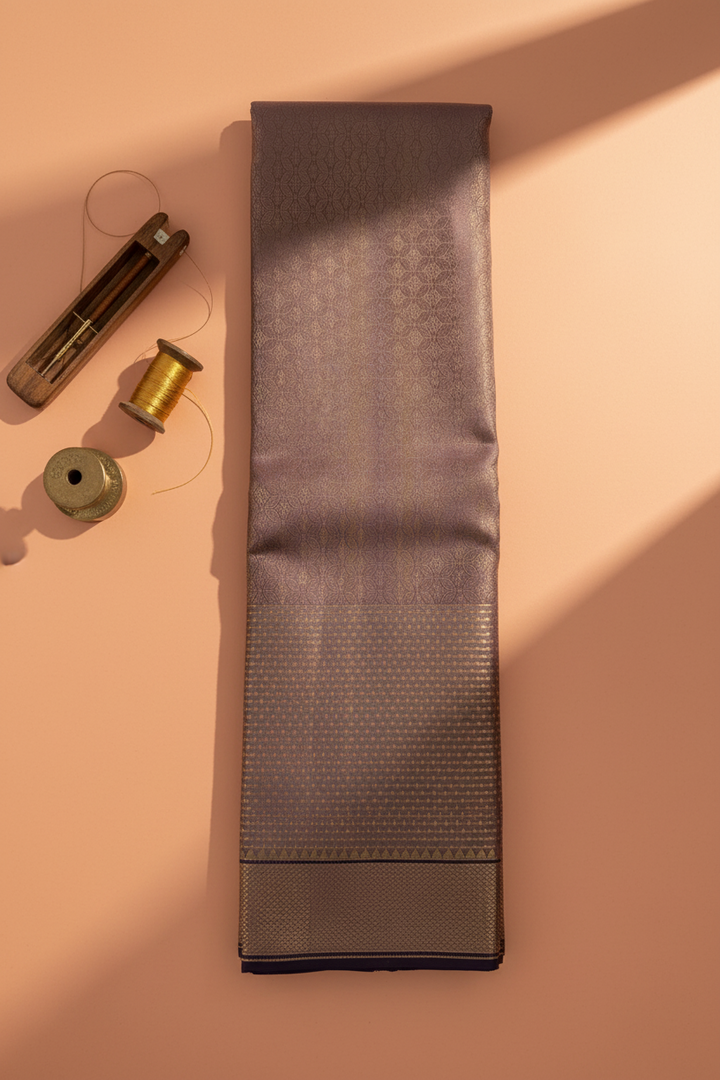 Kuberan Mauve Taupe with All-Over Gold Zari Interlocking Petal & Diamond Lattice Jaal & Broad Self-Colour Gold Zari Basket-Weave Border with Deep Navy Selvedge Kanchipuram Silk Saree