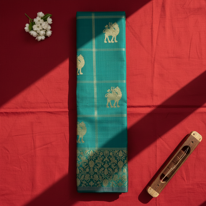 Kuberan Kanchipuram Silk Saree Peacock Teal with Scattered Gold Zari Yali Buttas on Fine Gold Zari Check Grid & Broad Self-Colour Teal Gold Zari Floral Border