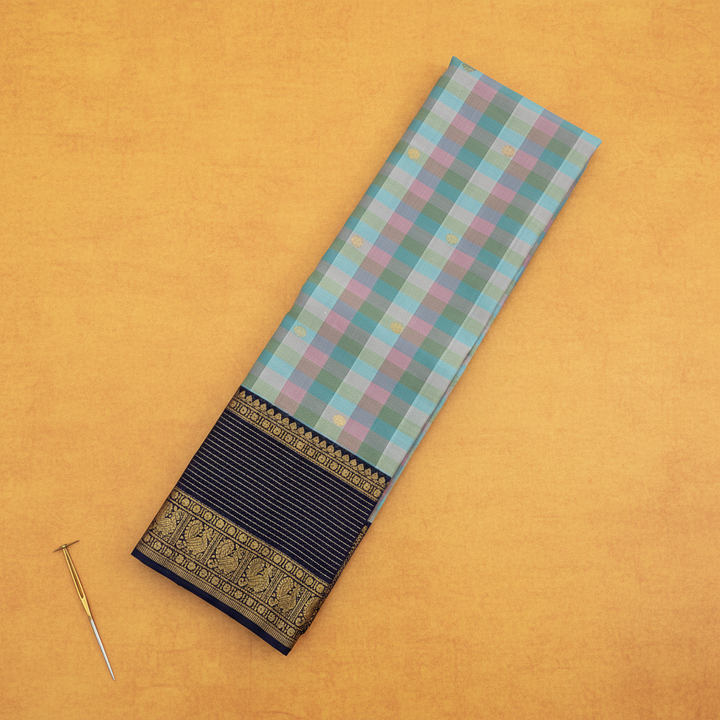 Kuberan Kanchipuram Silk Saree  Sky Blue Multi-Colour Gingham Checks with Scattered Gold Zari Mini Floral Buttas & Broad Midnight Navy Peacock & Temple Arch Border