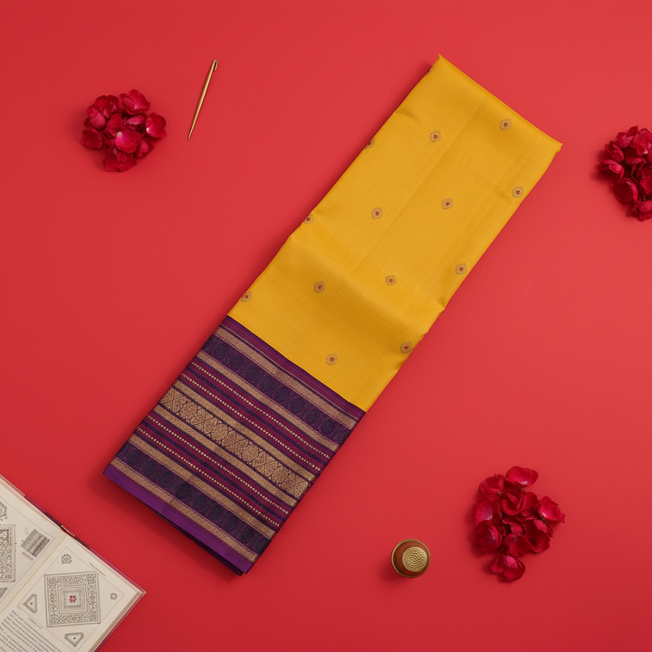 Kuberan Mango Yellow with Scattered Gold Zari Sunflower Medallion Buttas & Broad Deep Violet Multi-Stripe Zari Border Kanchipuram Silk Saree