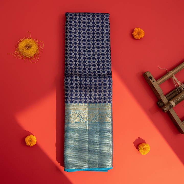 Kuberan  Midnight Navy Blue with All-Over Silver Zari Diamond & Rosette Jaal & Broad Contrast Sky Blue Gold Zari borderKanchipuram Silk Saree