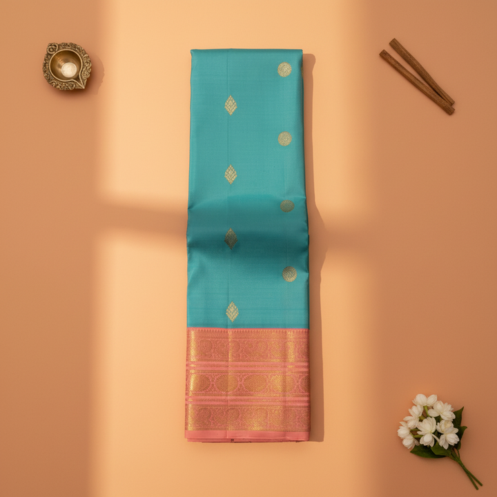 Kuberan Teal Blue Kanchipuram Silk Saree with Golden Diamond & Lotus Motifs and Rose Pink Peacock Zari Border